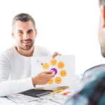 portrait-young-businessman-with-graph-office